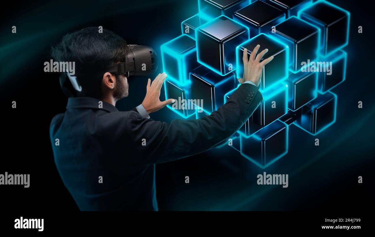 Businessman wearing virtual reality glasses touching blue glowing ...