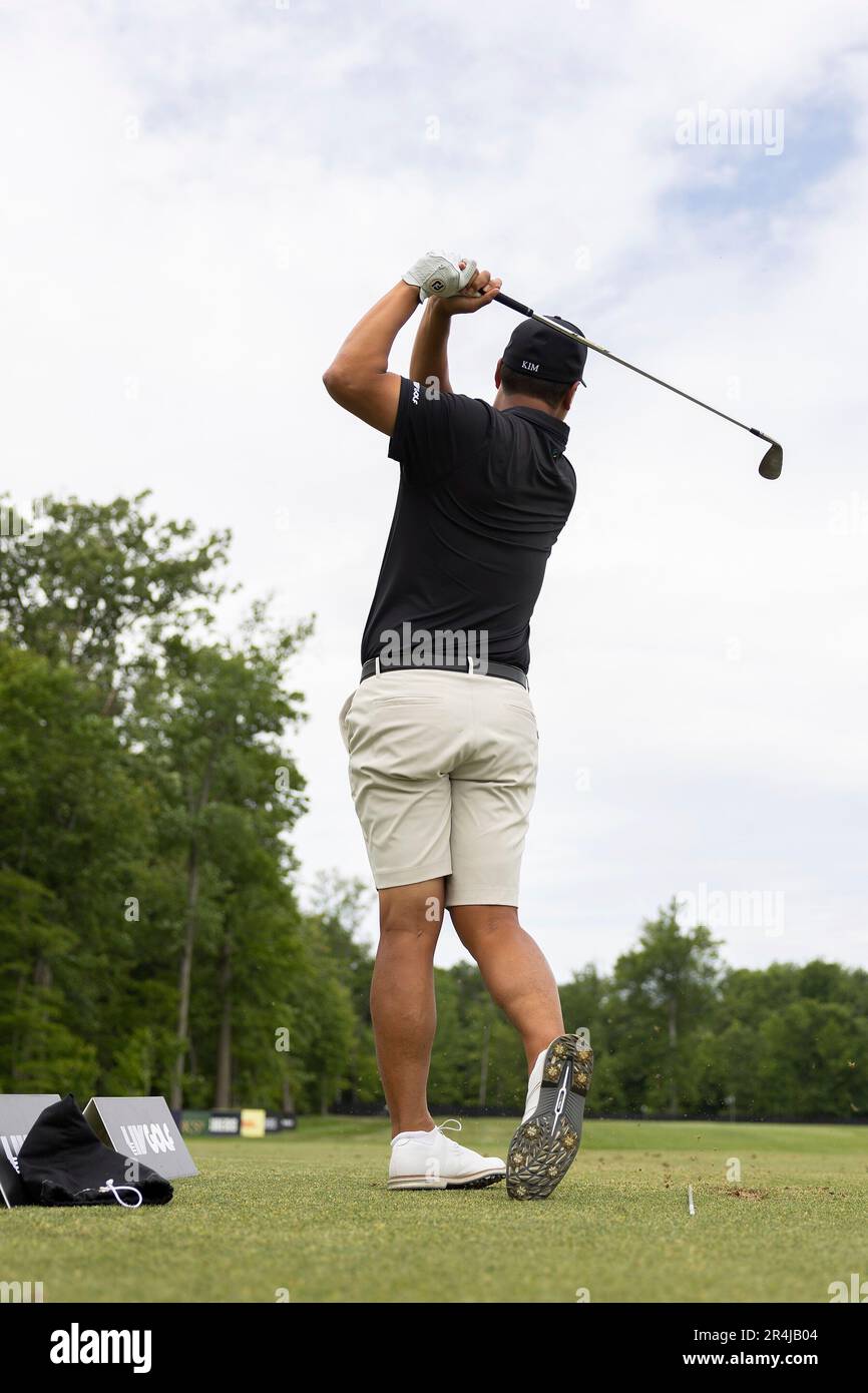 Sihwan Kim of Iron Heads GC hits his shot on the driving range during