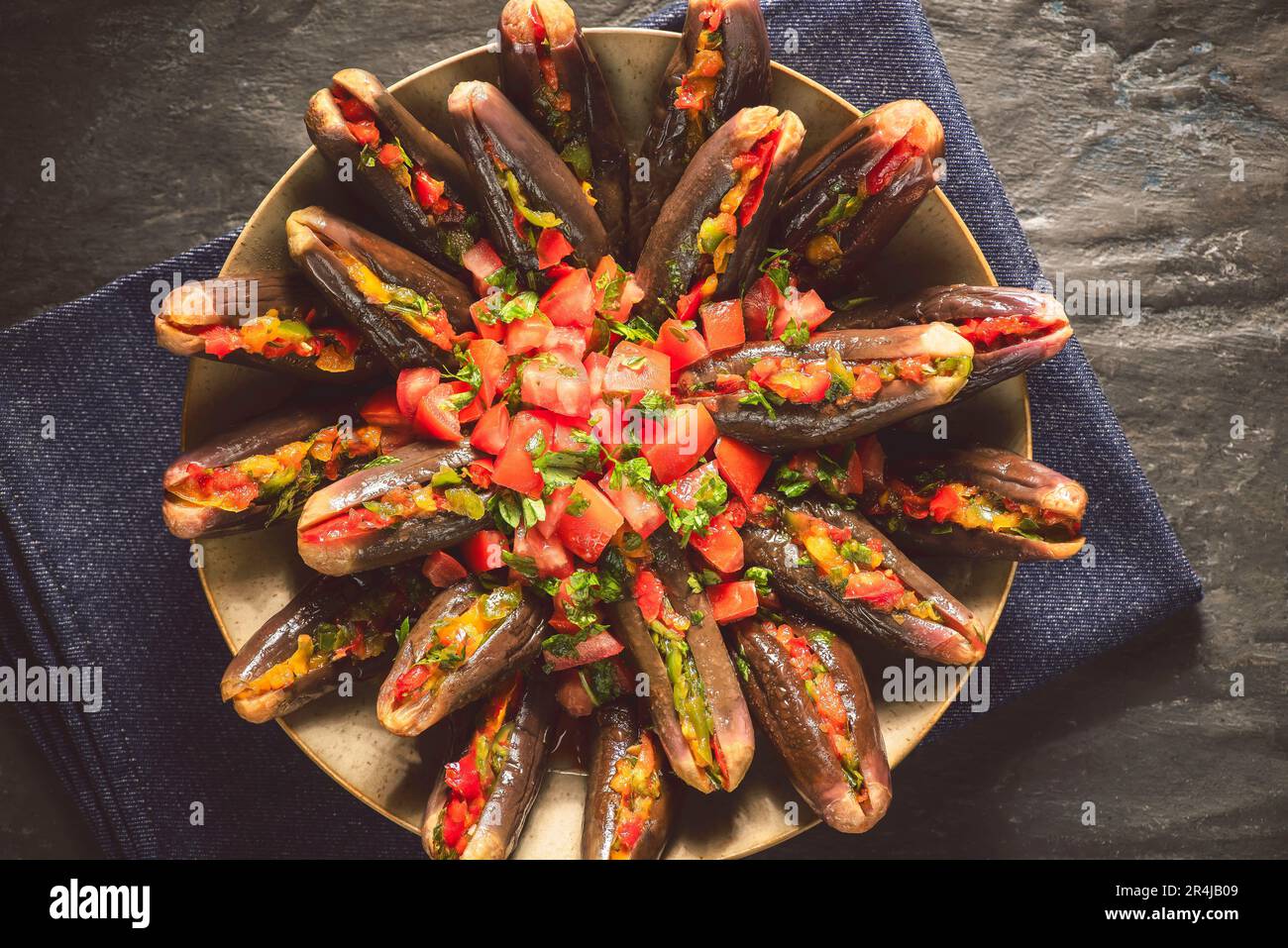Arabic Cuisine; Egyptian traditional spicy pickled eggplant topped with fresh marinated tomatoes