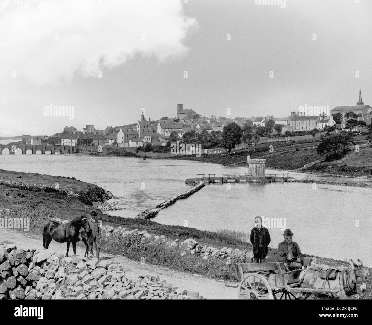 A late 19th century view of locals near Ballyshannon, a town in County Donegal, Ireland, situated at the mouth of the River Erne that marks the southern boundary of historic Tir Chonaill. Sites dating back to Neolithic times have been excavated in and around the town showing evidence of early human settlements. It was an important stronghold for the O'Donnells. Niall Garbh O Domhnaill built the castle at Ballyshannon in 1423 and the grave of Red Hugh O’Donnell is said to be beneath St. Anne’s Church. Stock Photo