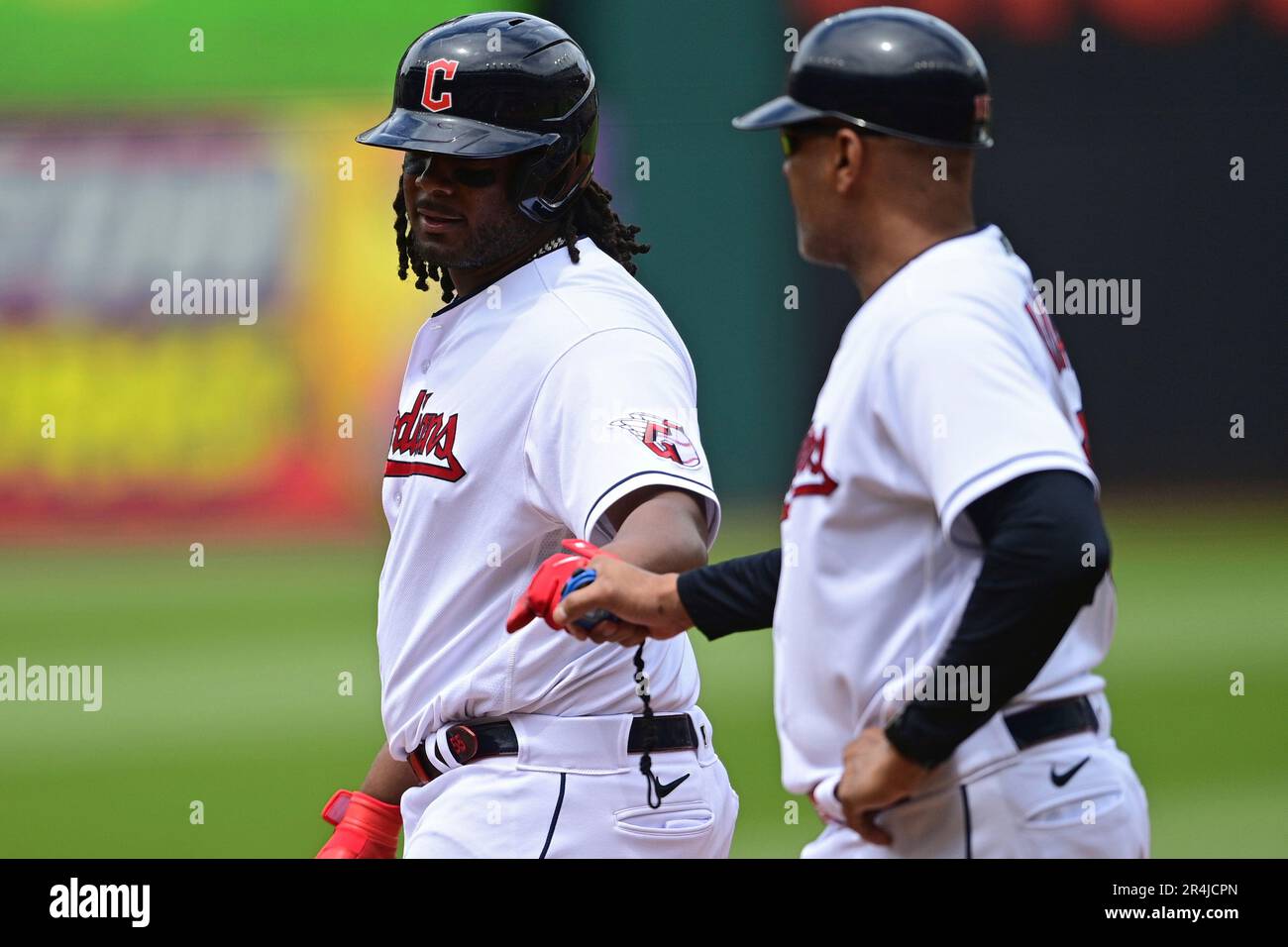 Cleveland Guardians' Josh Bell, left, is congratulated by first base