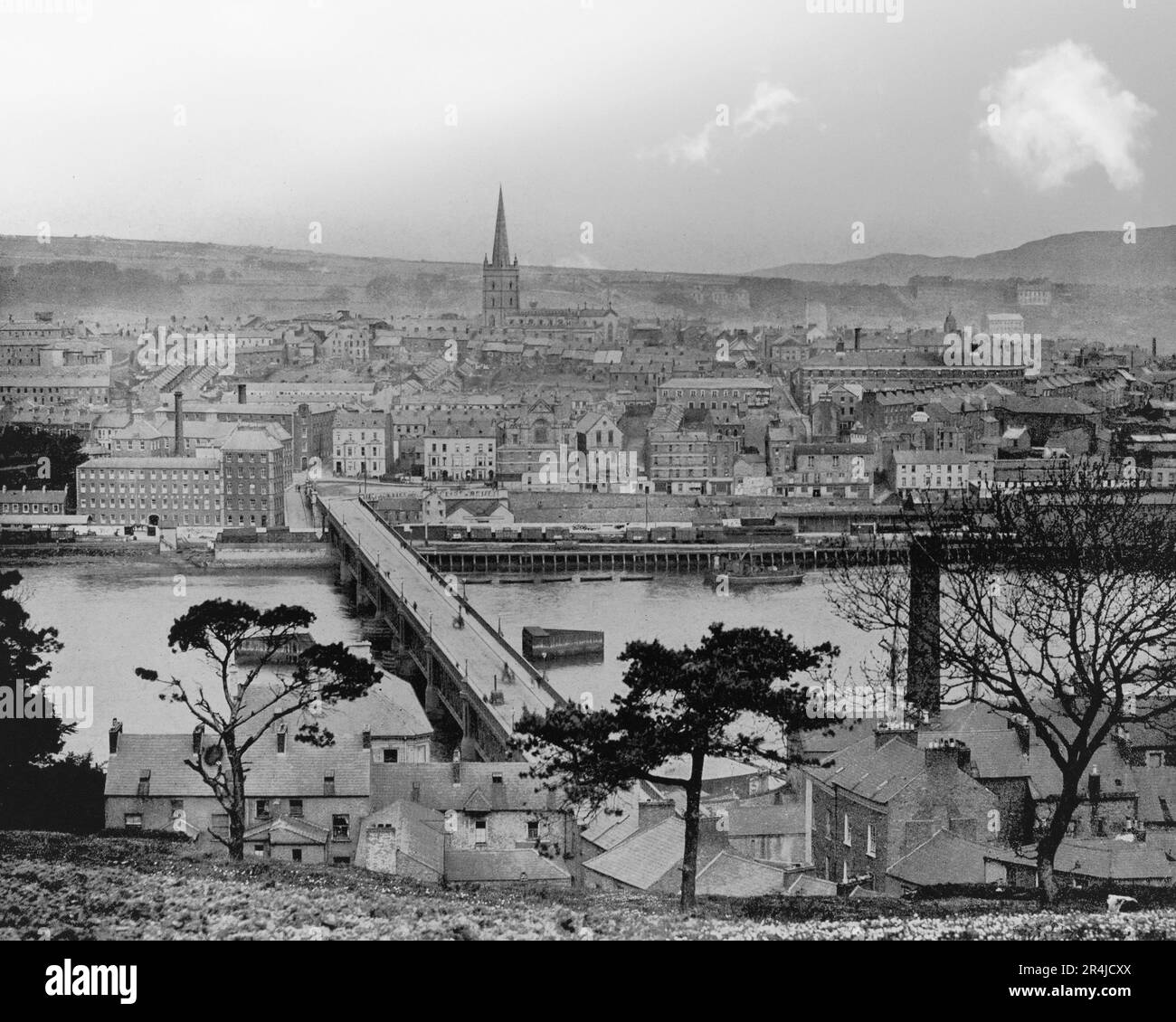 A late 19th century view of the Craigavon Bridge over the River Foyle erected in 1863, a little further upstream to replace an earlier wooden bridge. Derry City, aka Londonderry City, the second-largest city in Northern Ireland. The old walled city lies on the west (far) bank of the River Foyle. Stock Photo