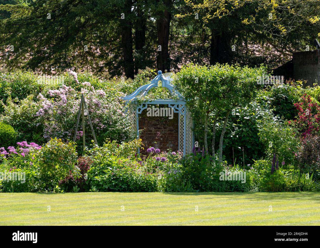A flower border in the landscaped garden at West Green House, in