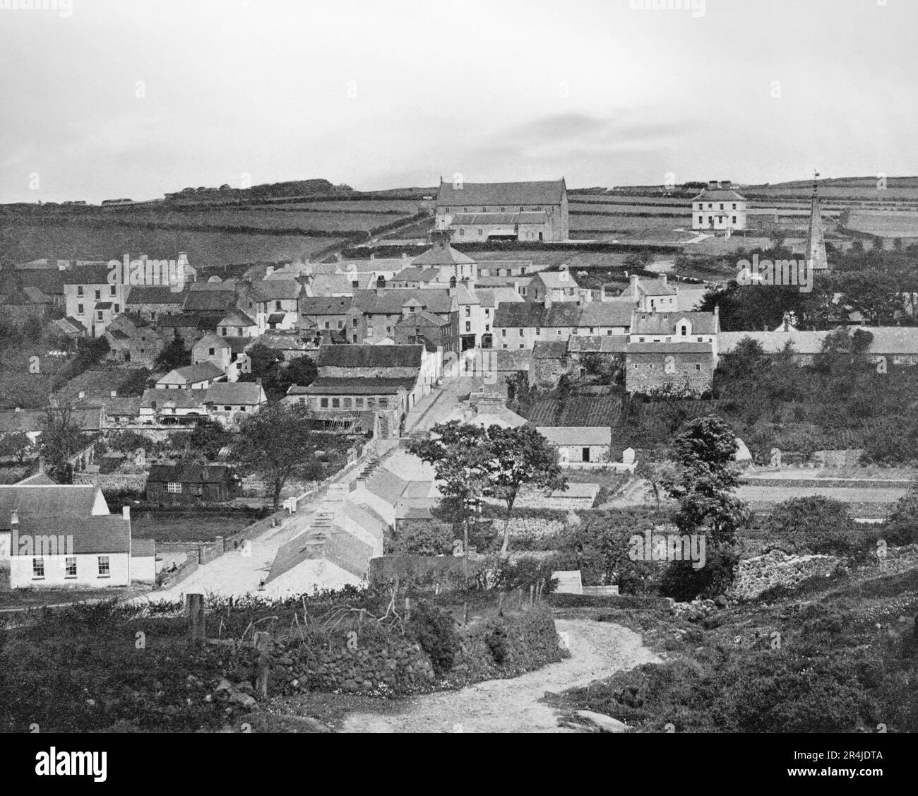A late 19th century  view of Ballycastle, a small seaside town in County Antrim, Northern Ireland. It can trace its history back to the founding of a settlement around Port Brittas, the old name for Ballycastle Bay. It is from here that it has been suggested that Fergus Mór mac Eirc, a purported king of Dalriada, sailed to Scotland. Today the town hosts the Ould Lammas Fair held on the last Monday and Tuesday of August. Stock Photo