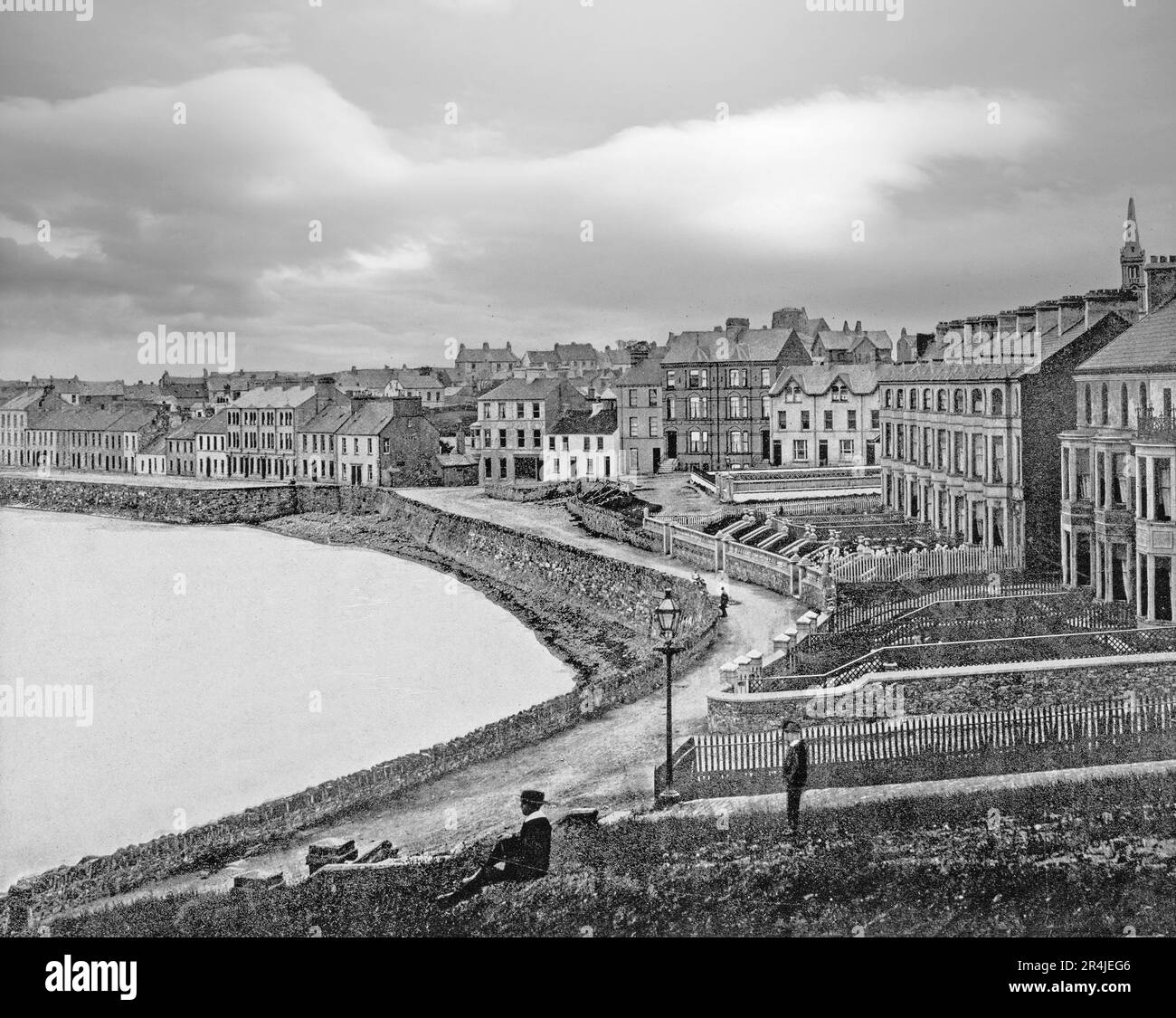 A late 19th century view of the sea front in Bangor, a city and seaside resort in County Down, Northern Ireland, on the southern side of Belfast Lough. The site of a Gaelic Irish monastery renowned throughout Europe for its learning and scholarship, Bangor was the victim of violent Viking raids in the 8th and 9th centuries, and the new home of Scottish and English planters during the Plantation of Ulster. Stock Photo