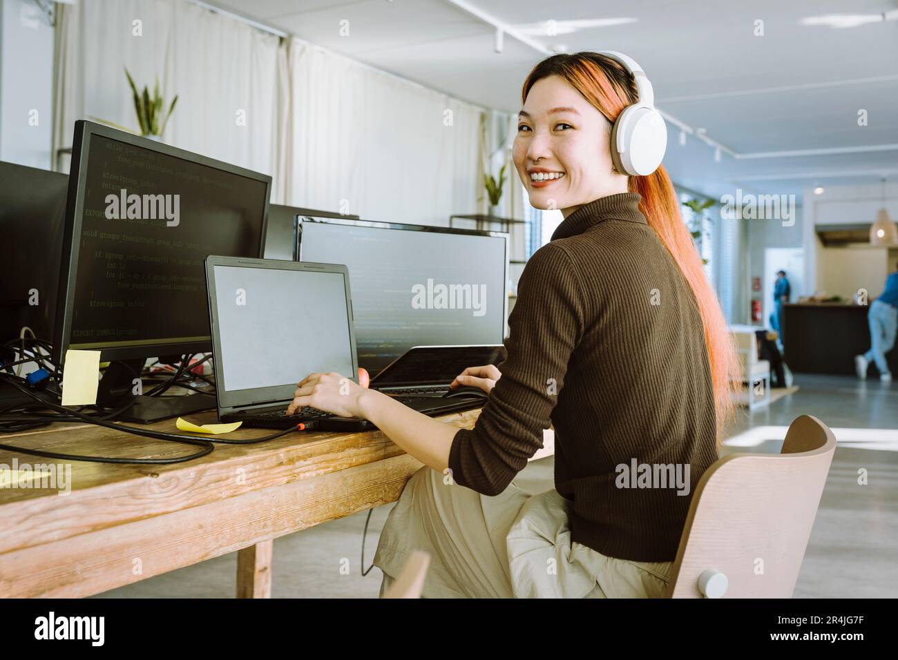 Female programmer working laptop hi-res stock photography and images ...
