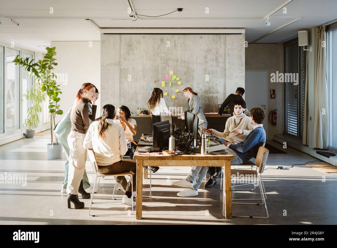 Multiracial male and female colleagues working in creative office Stock Photo