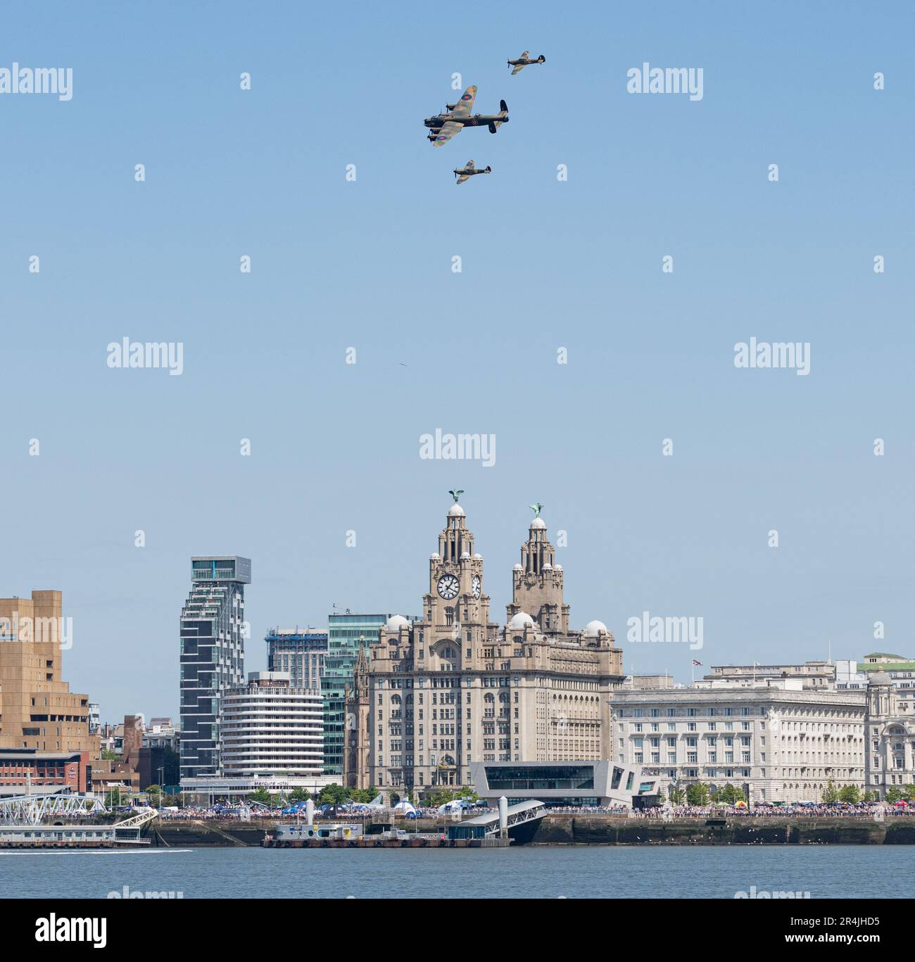 Liverpool Pier Head, Liverpool, Merseyside, England. 27th May 2023. Battle of Britain memorial fly performs a flypast with the Spitfire, Lancaster and Hurricane in formation over Liverpool, during the Battle of the Atlantic 80th anniversary at Pier Head. (Credit Image: ©Cody Froggatt/Alamy Live News) Stock Photo