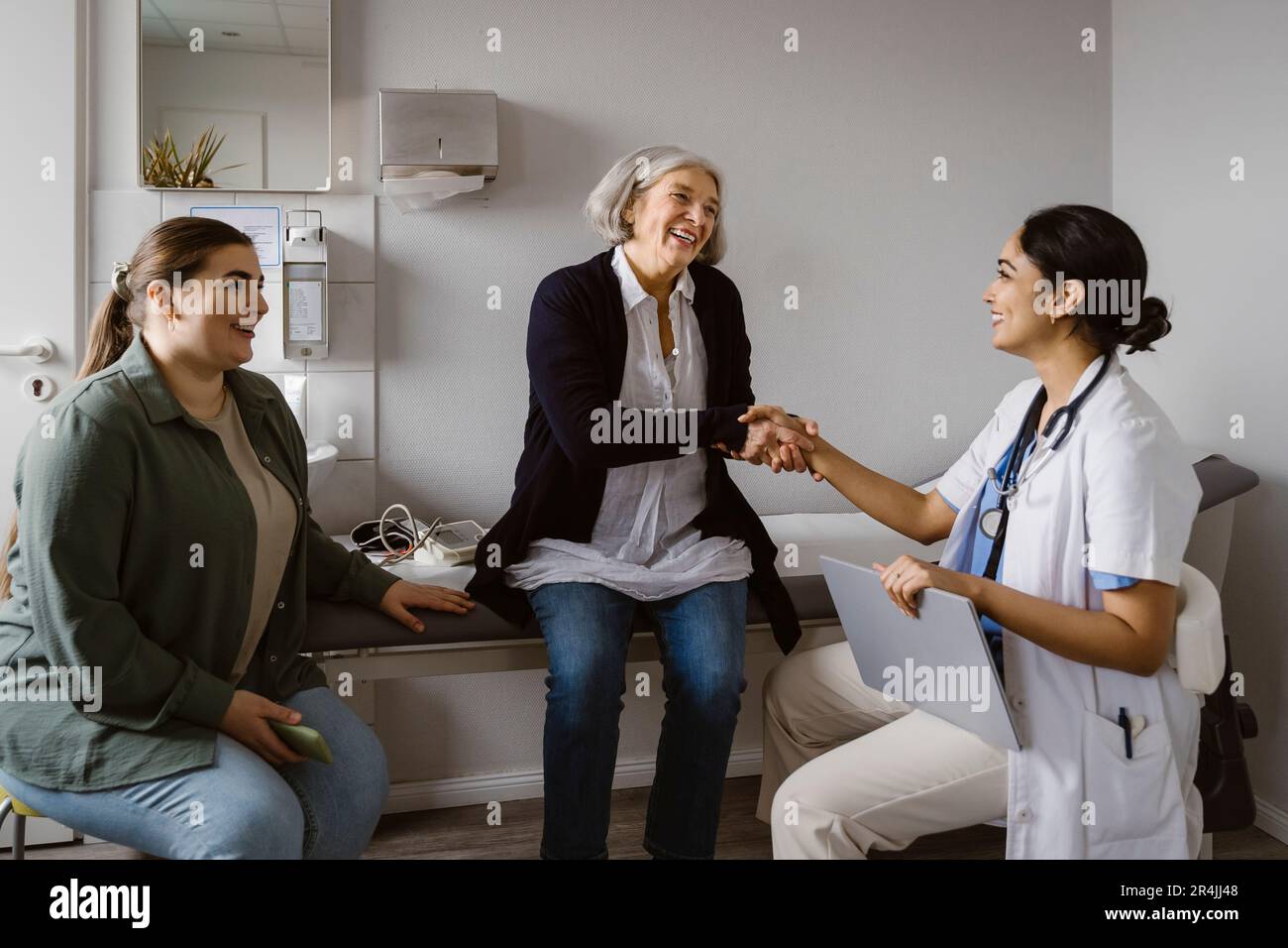 Indian woman doctor shaking hand hi-res stock photography and images ...