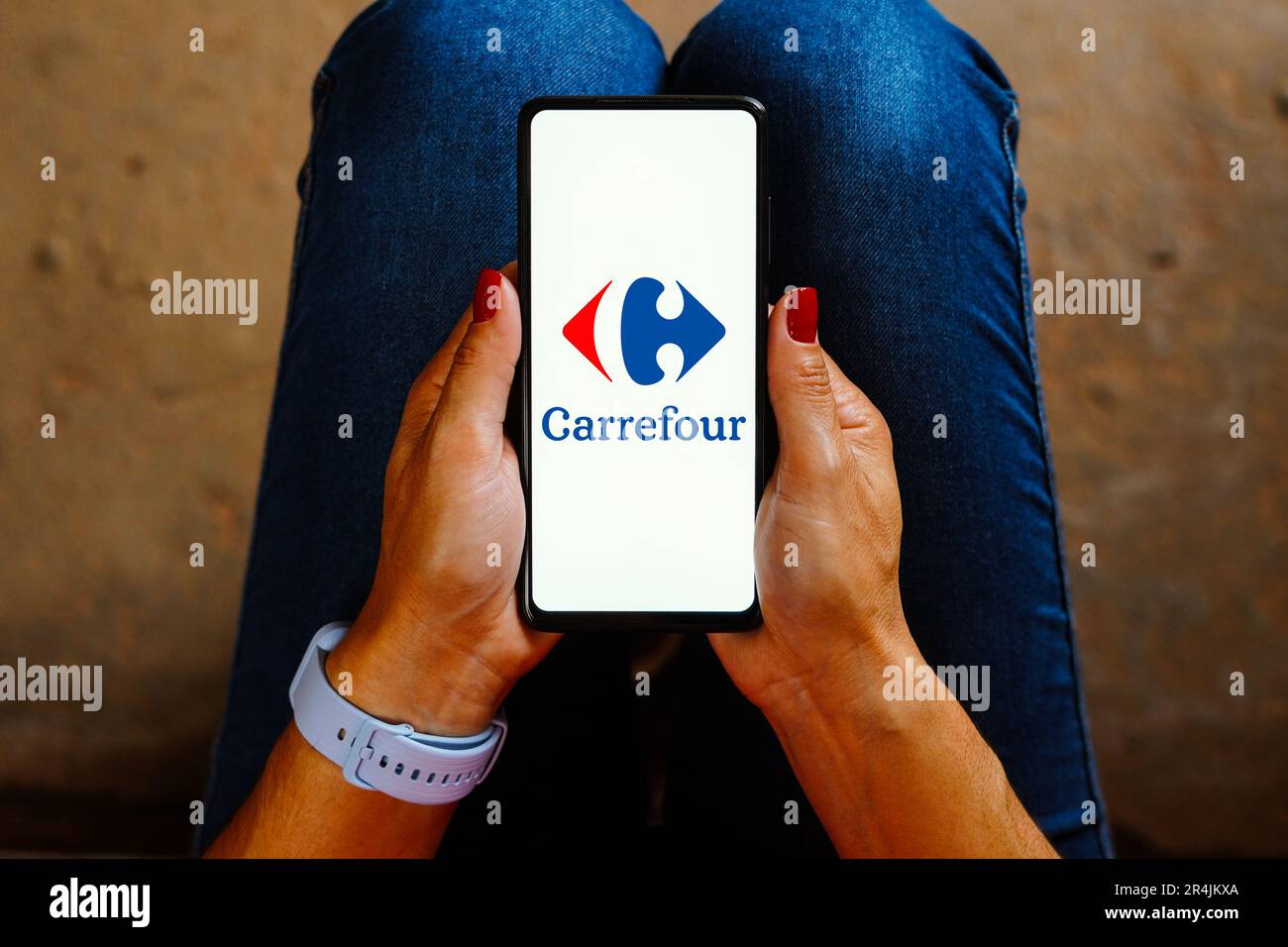 In this photo illustration, the Carrefour logo is displayed on a smartphone screen. Stock Photo