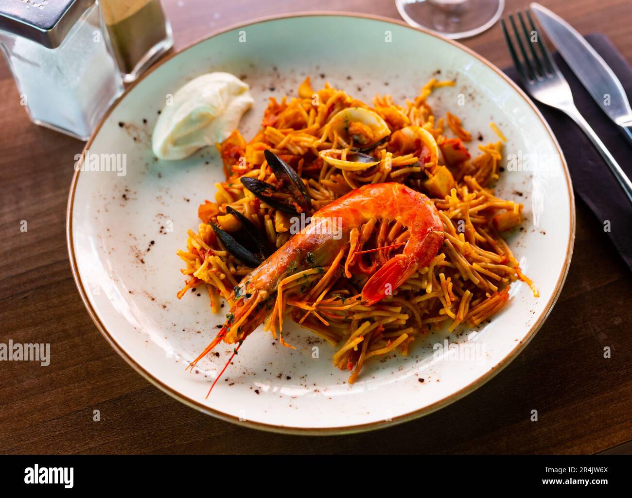 Dish of Valencian cuisine Fideua with seafood and noodles Stock Photo
