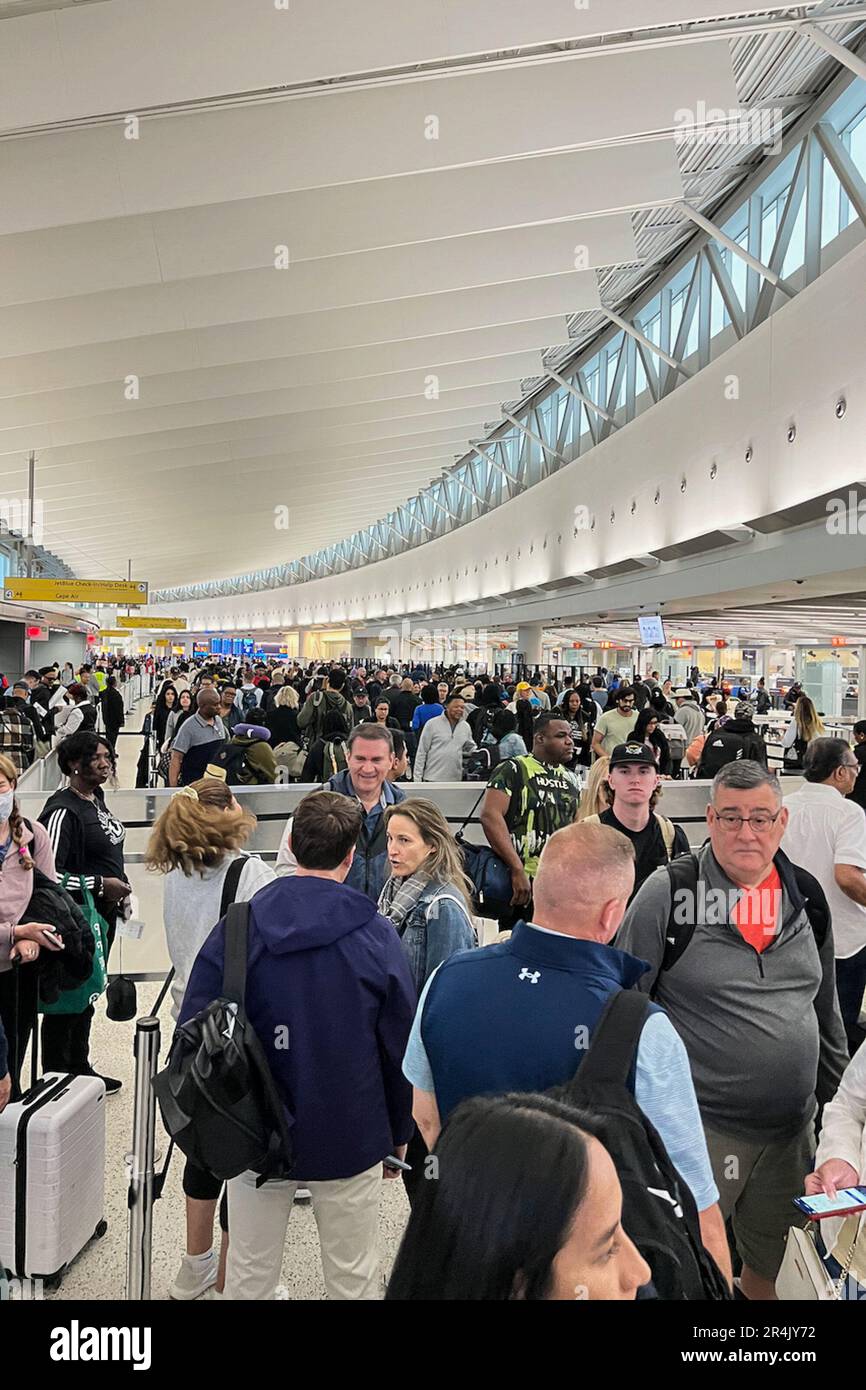 Queens, United States. 24th May, 2023. Travelers wait in lines in the