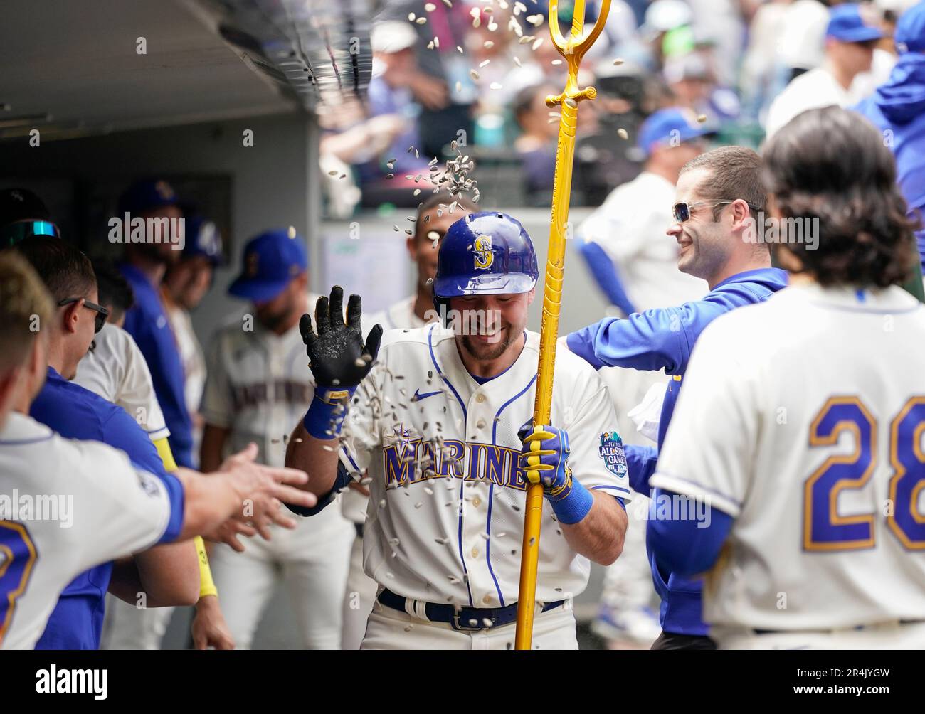Seattle Mariners' Jose Caballero holds a trident in the dugout after  hitting a three-run home run against the Oakland Athletics in a baseball  game Monday, May 22, 2023, in Seattle. (AP Photo/Lindsey