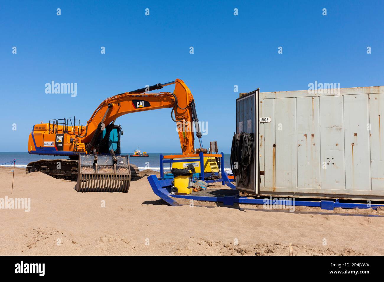 Caterpillar earthmovers working on an Environment Agency beach