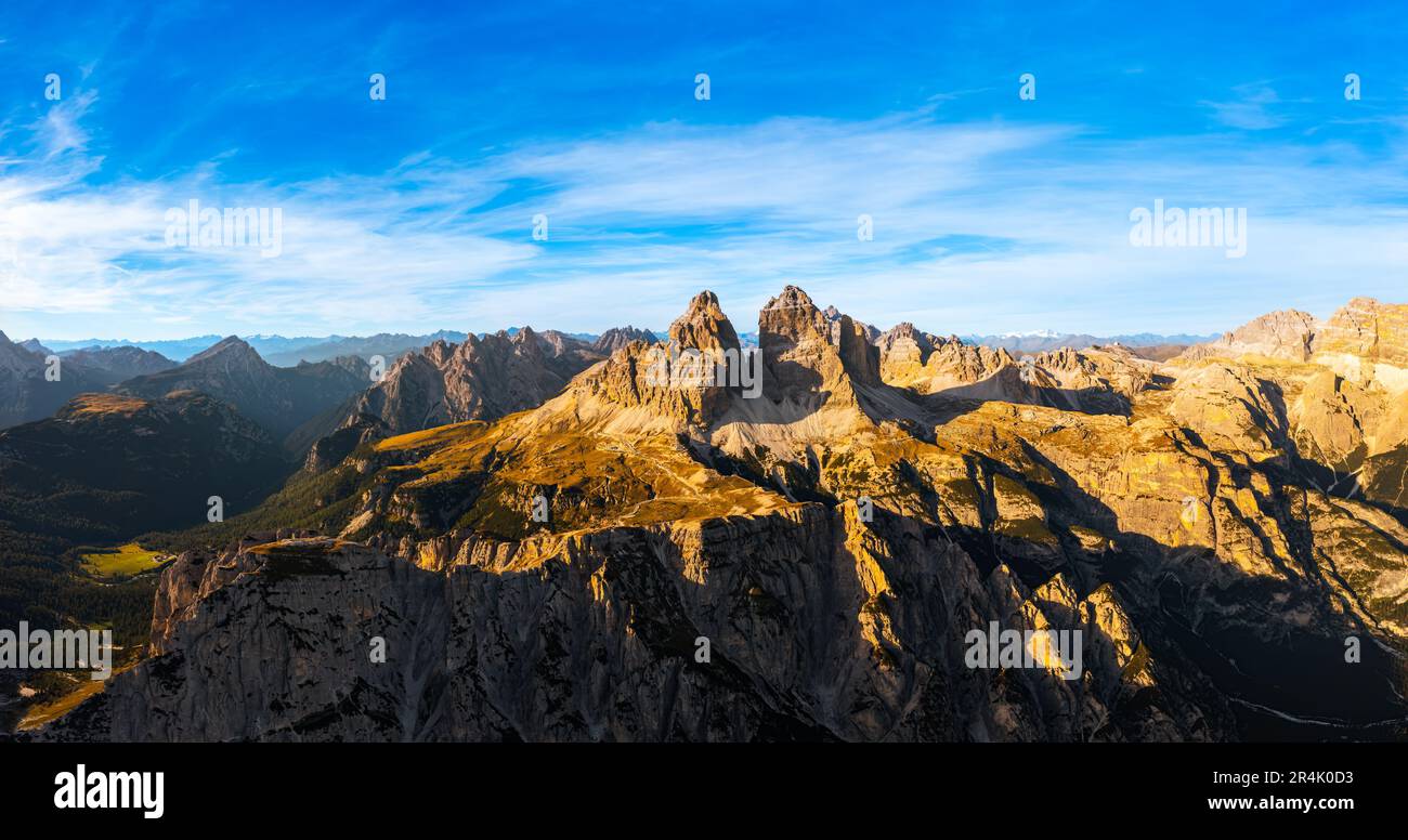 Mountain ranges of Alps under blue sky with white clouds. Rocky peaks ...