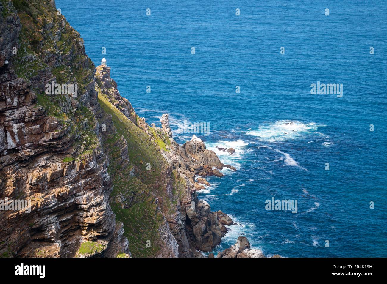 Cape Point Lighthouse surrounded by the ocean, South Africa Stock Photo ...