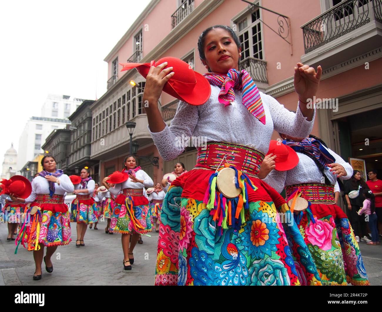 Lima, Peru. 28th May, 2023. Women in traditional costumes dancing in the streets when Peruvian Indigenous folk dancers and Andean devotees wearing traditional costumes took to the streets of Lima downtown again to celebrate the Pentecost day. Pentecost is the Christian feast of the fiftieth day of Easter time that sets the solemn culmination of Easter itself. Credit: Fotoholica Press Agency/Alamy Live News Stock Photo