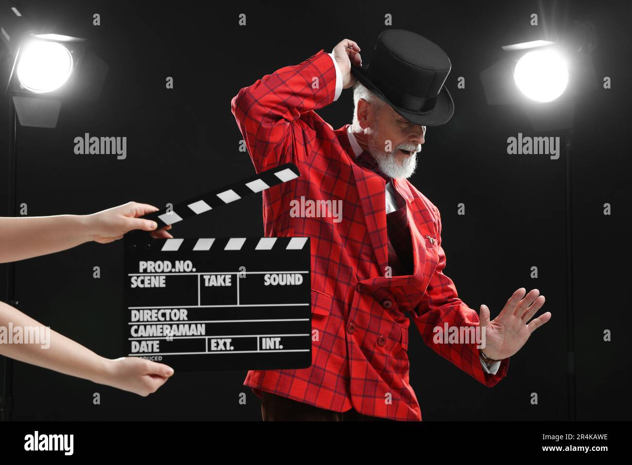 Senior actor performing role while second assistant camera holding ...