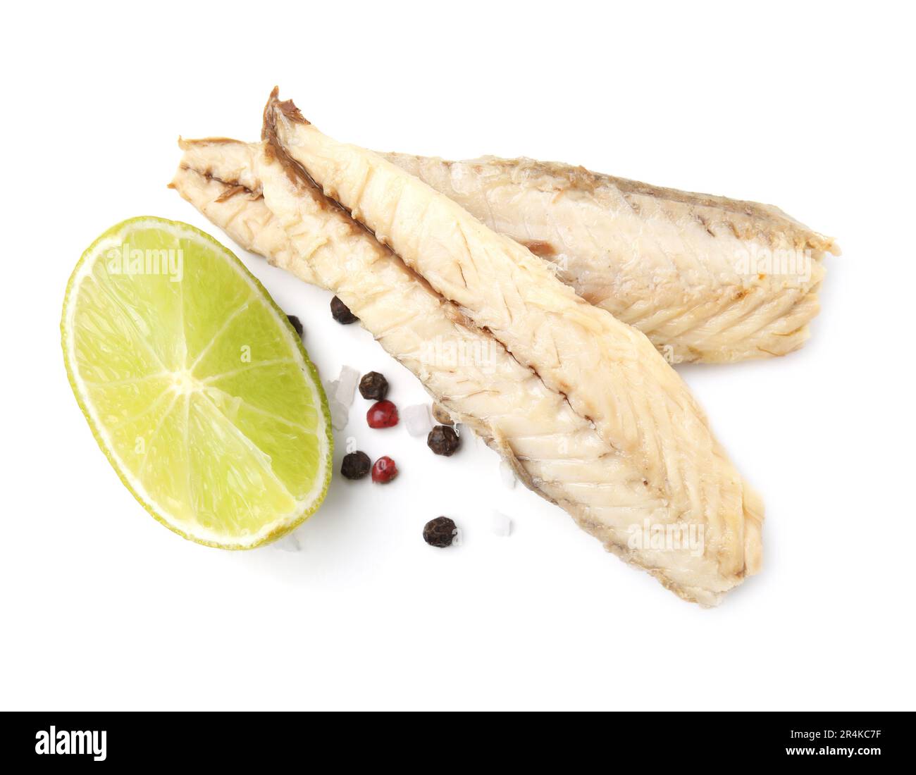 Canned mackerel fillets with lime and spices on white background Stock