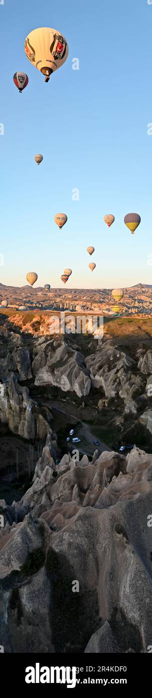 Hot air balloons during an early morning flight, near the Zelve Open Air Museum, Cappadocia, Turkey Stock Photo