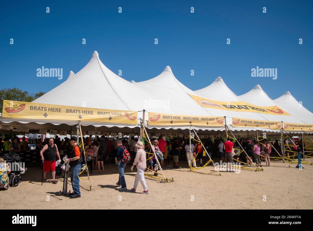 People enjoy the 2023 Bratfest, put on by Metcalfe Grocery, at the Dane County Coliseum, Madison, Wisconsin, USA on a beautiful summer day. Stock Photo