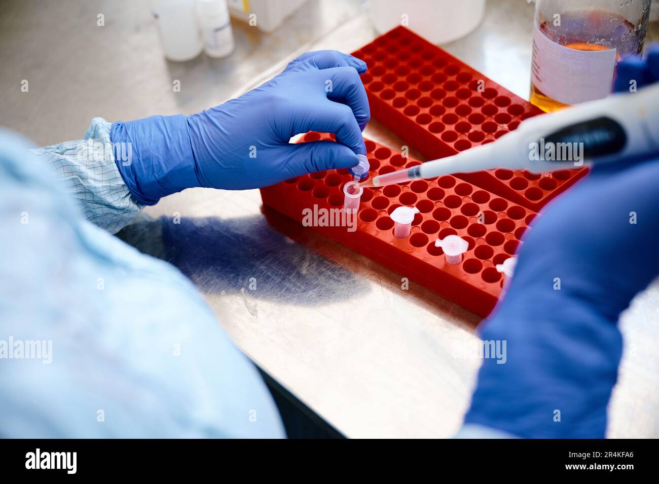 Technician works investigating analysis sample in test tubes Stock Photo