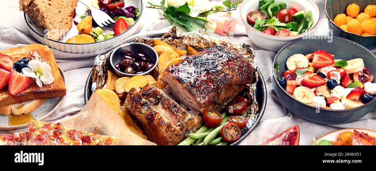 Family dinner or lunch. Many dishes on the table. Stock Photo