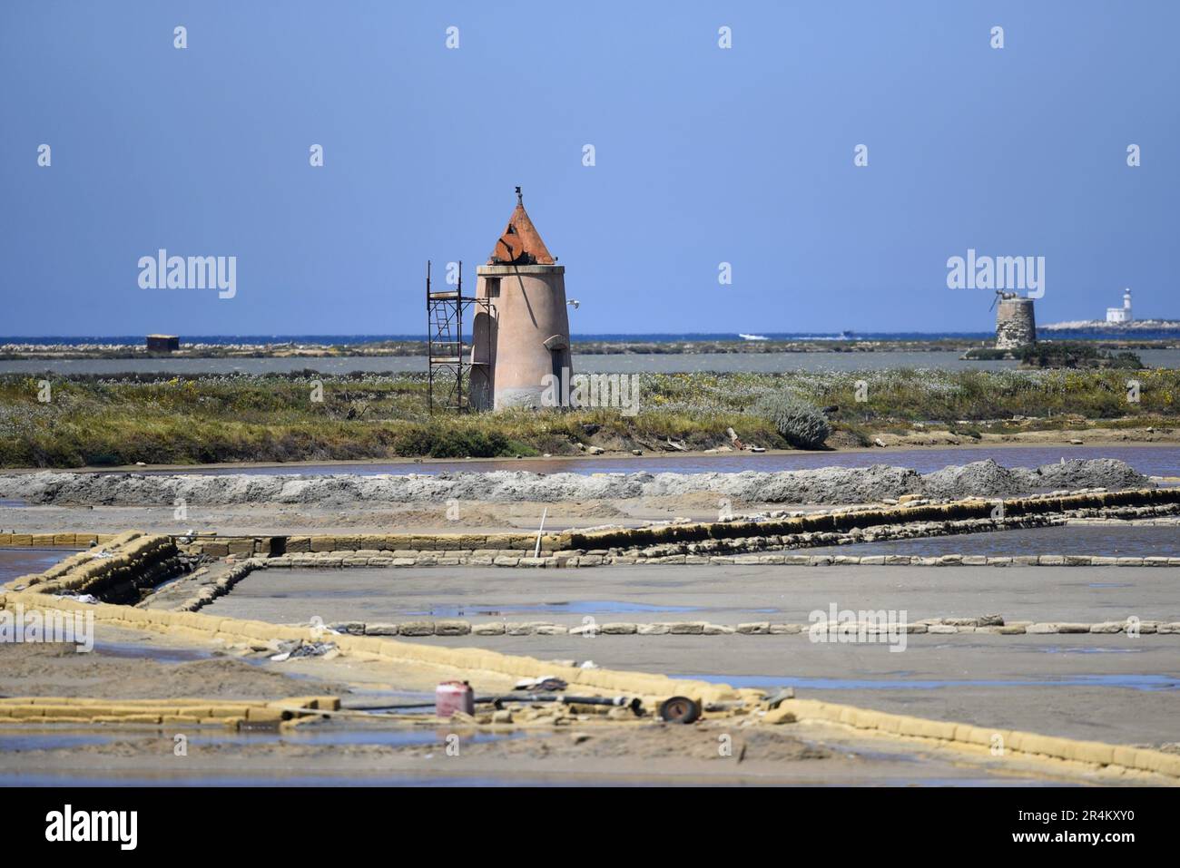 Landscape with panoramic view of Galia Canino a traditional salt pan in the Saline di Trapani e Pacheco, Nubia Sicily Italy. Stock Photo