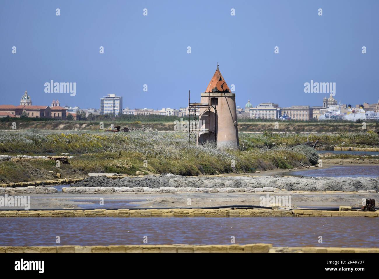 Landscape with panoramic view of Galia Canino a traditional salt pan in the Saline di Trapani e Pacheco, Nubia Sicily Italy. Stock Photo