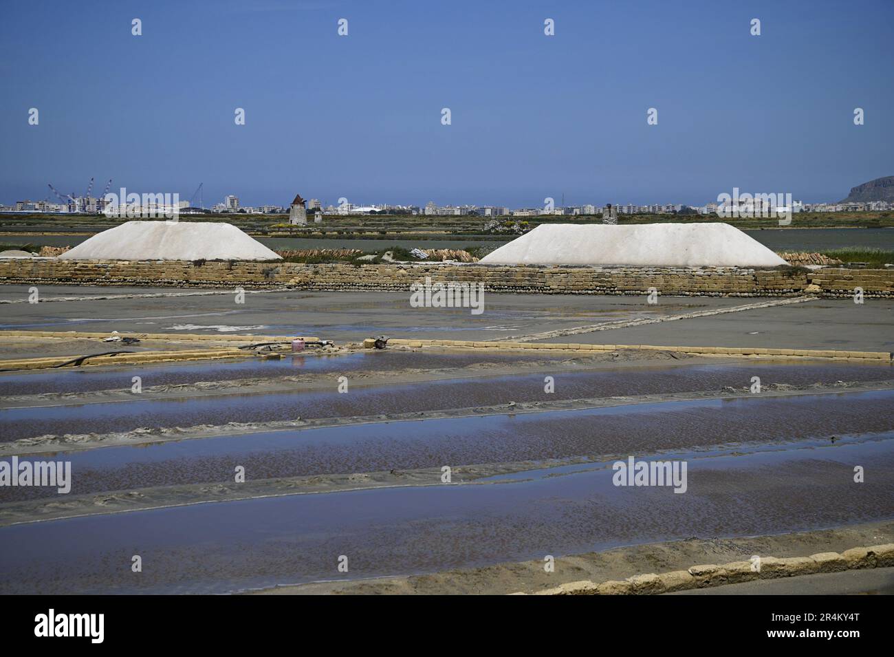 Landscape with panoramic view of Salina Chiusicella a traditional salt pan in the Natural Reserve of Trapani and Pacheco, Nubia Sicily Italy. Stock Photo