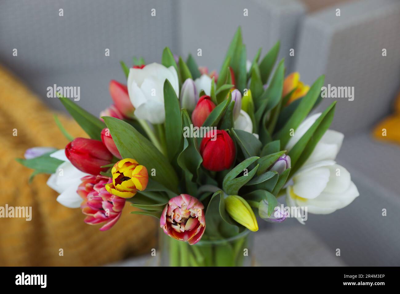 Beautiful bouquet of colorful tulips on blurred background, closeup view Stock Photo