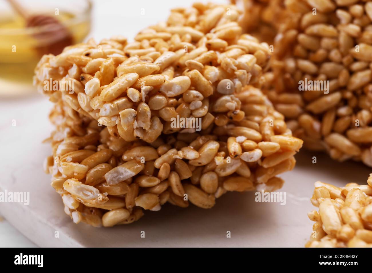 Puffed rice bars (kozinaki) on white table, closeup Stock Photo