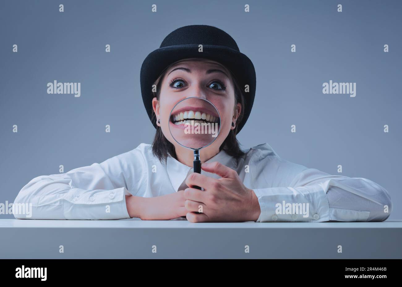 Woman with a bowler hat creates a vintage vibe. Hilariously, she uses a
