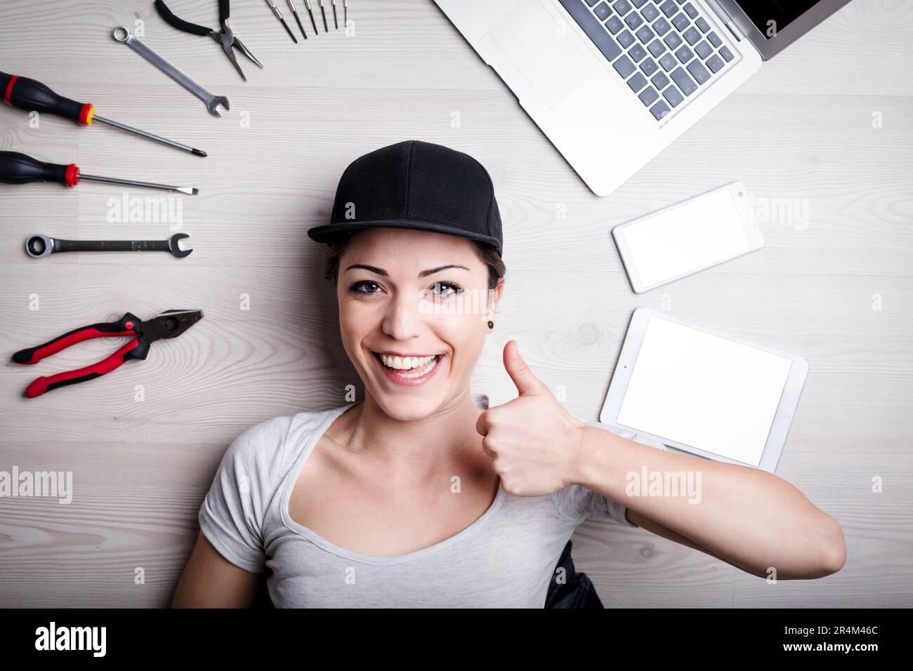 Overhead shot of IT technician joyfully celebrating his skilled problem ...