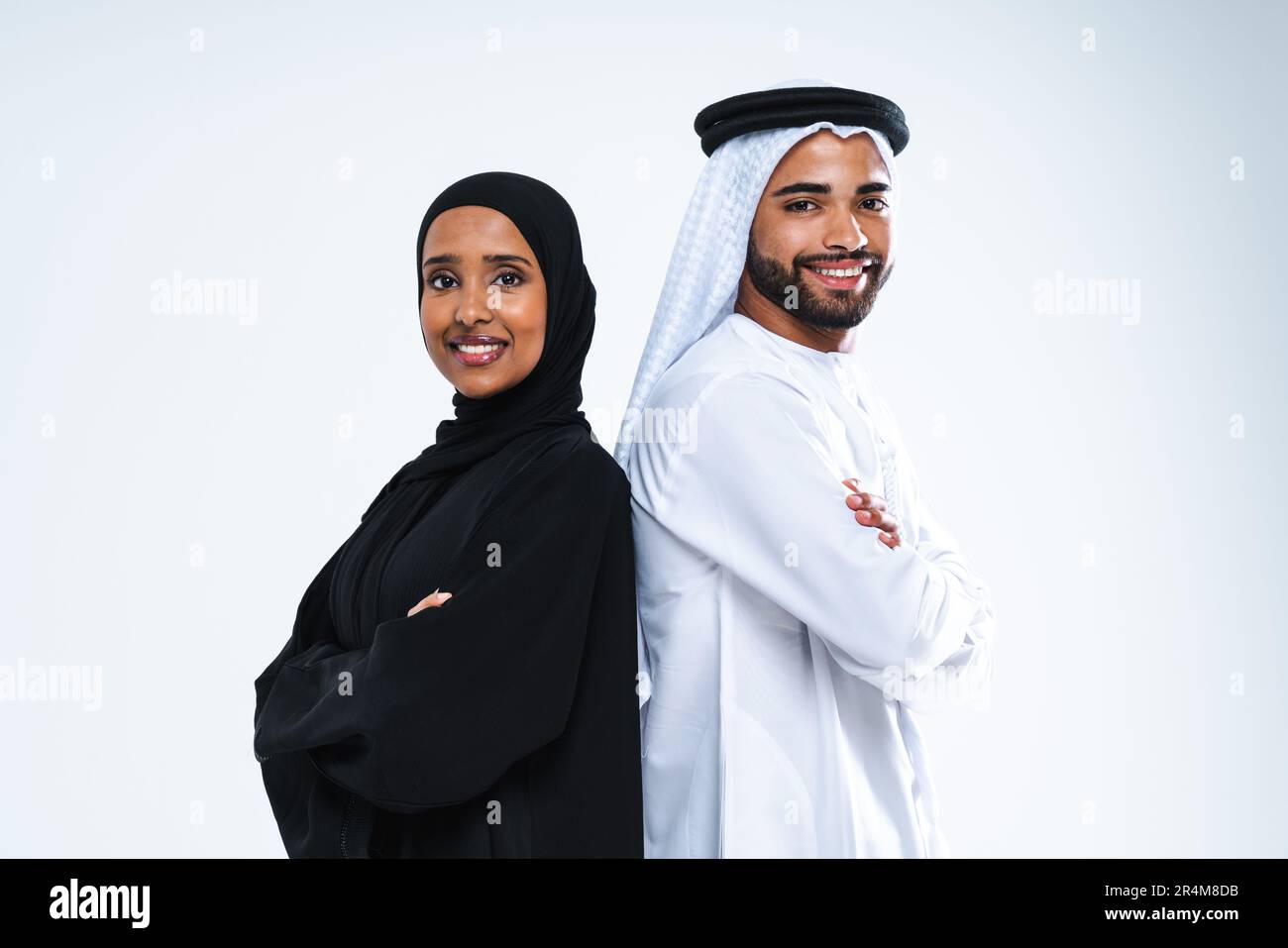 Beautiful arab middle-eastern happy couple of lovers wearing traditional  abaya and kandora in studio - Arabic muslim adult people bonding and having  f Stock Photo - Alamy