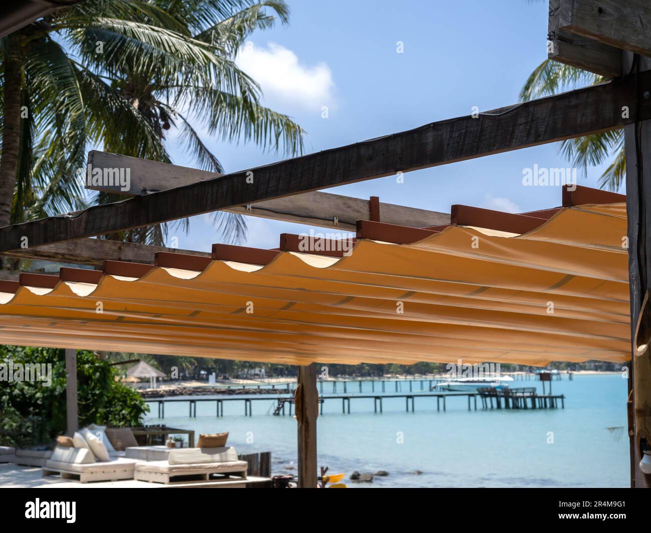 Outdoor retractable roof on wood and iron construction on the beach