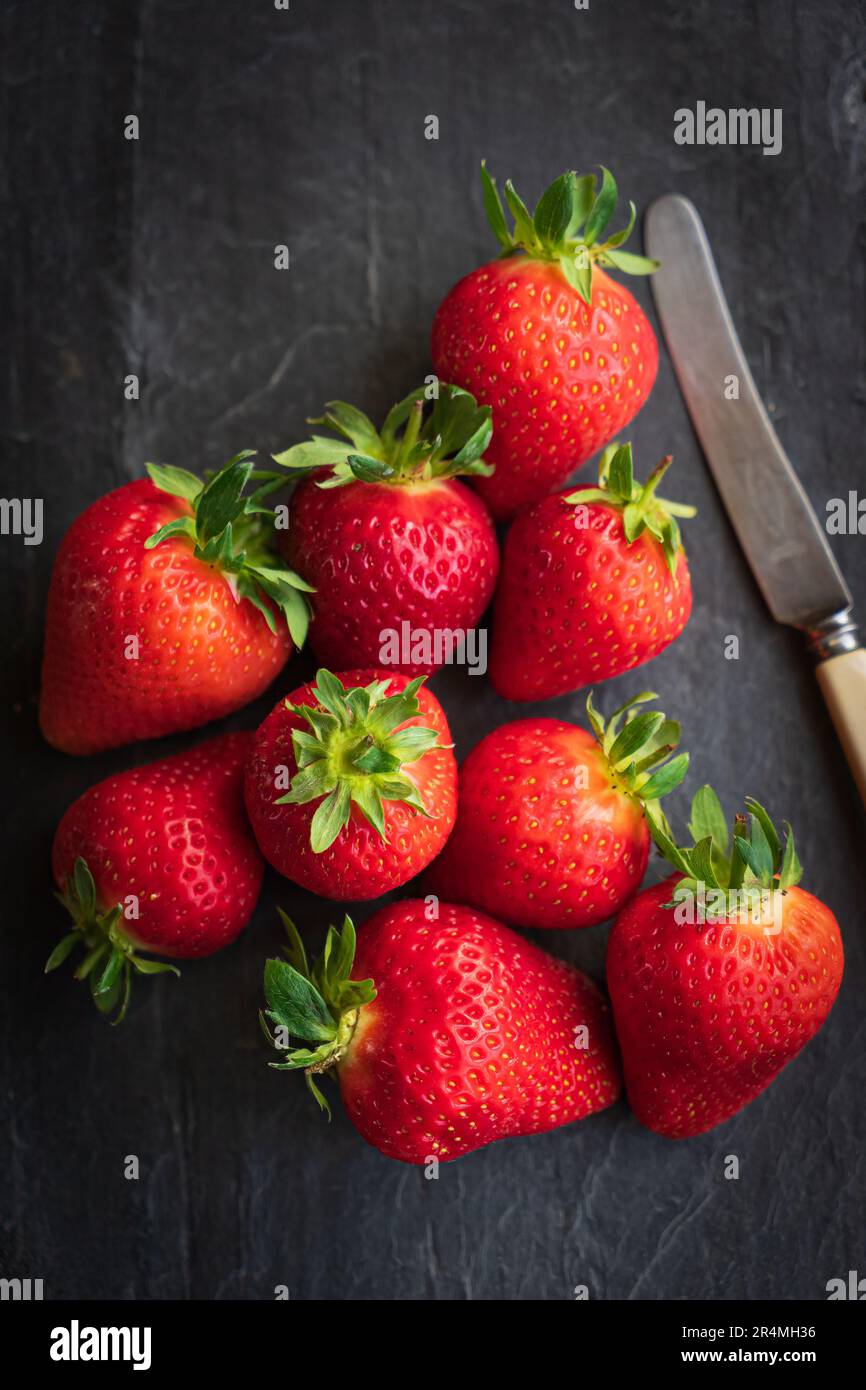Summer Strawberries on a slate background Stock Photo