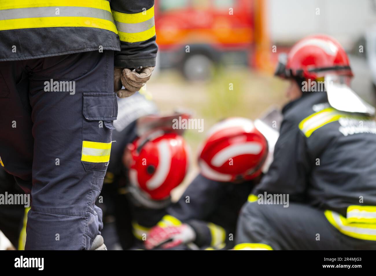 Car Crash Traffic Accident. Firefighters Rescue Injured Trapped Victims. Firemen give First Aid to passengers. High quality photography. Stock Photo