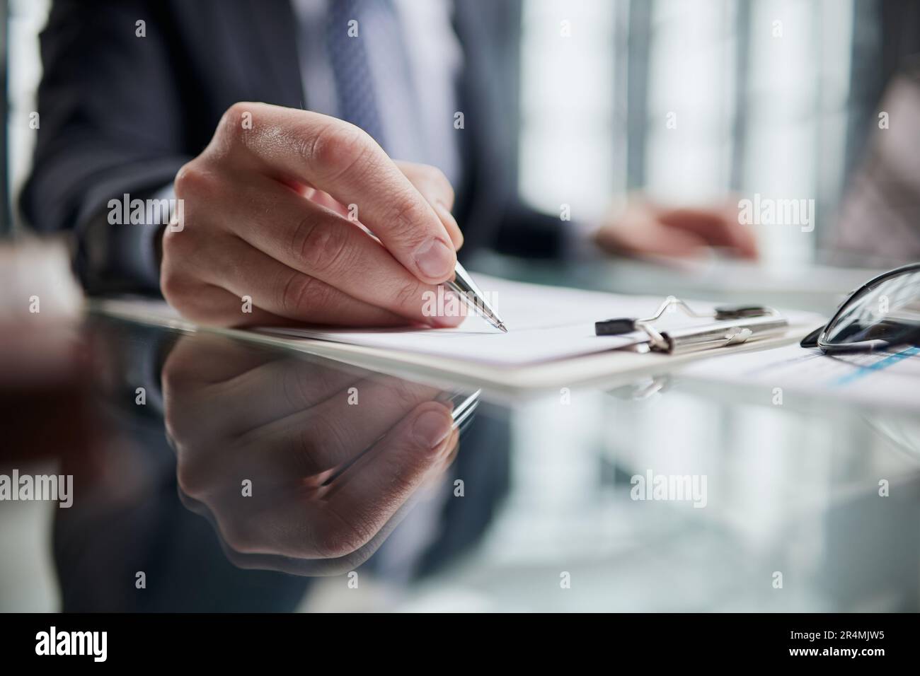 Hand makes notes on a paper notebook, close-up Stock Photo - Alamy