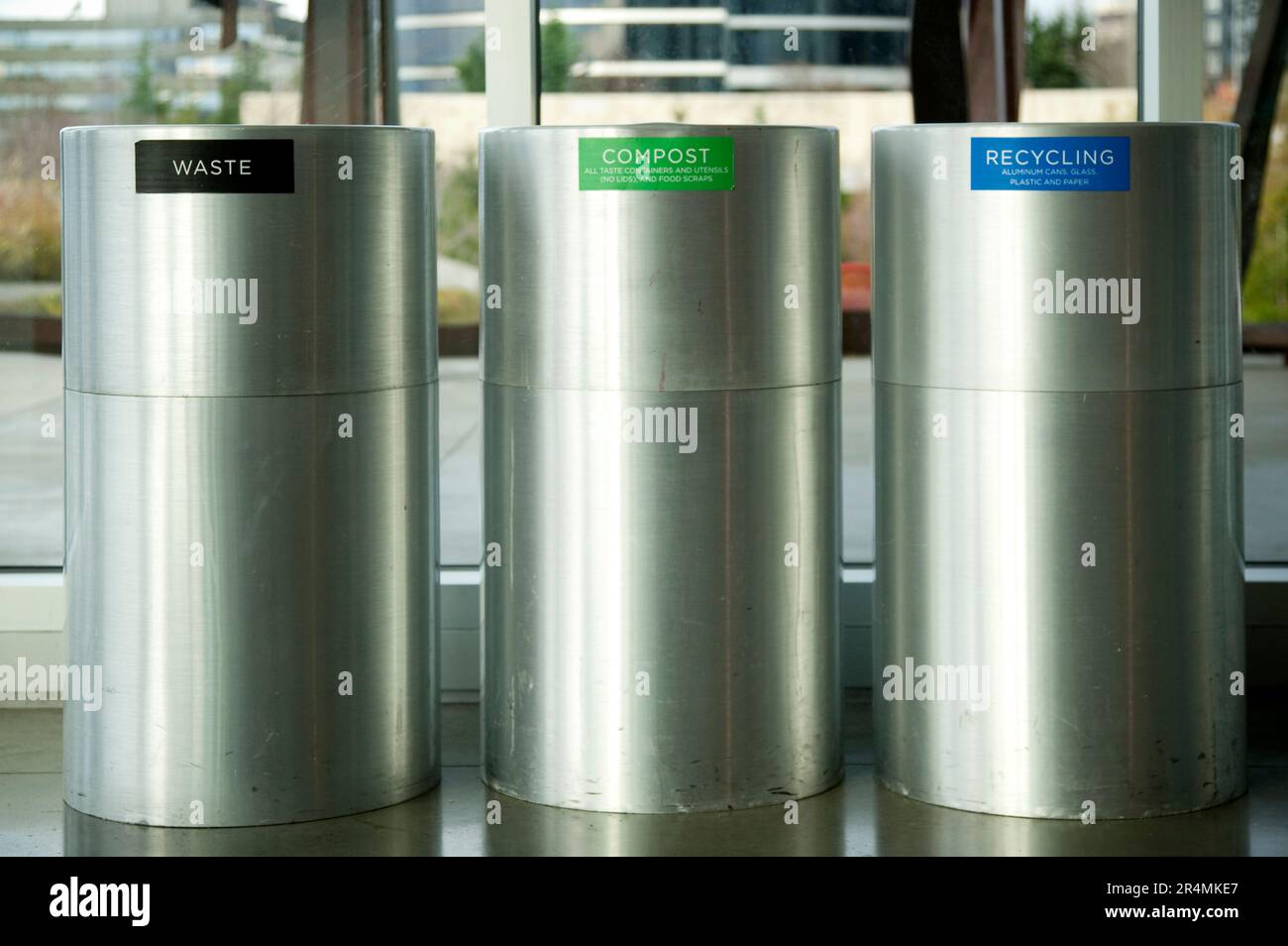Three metal bins in a row indicating Waste, Compost and Recycling. Stock Photo