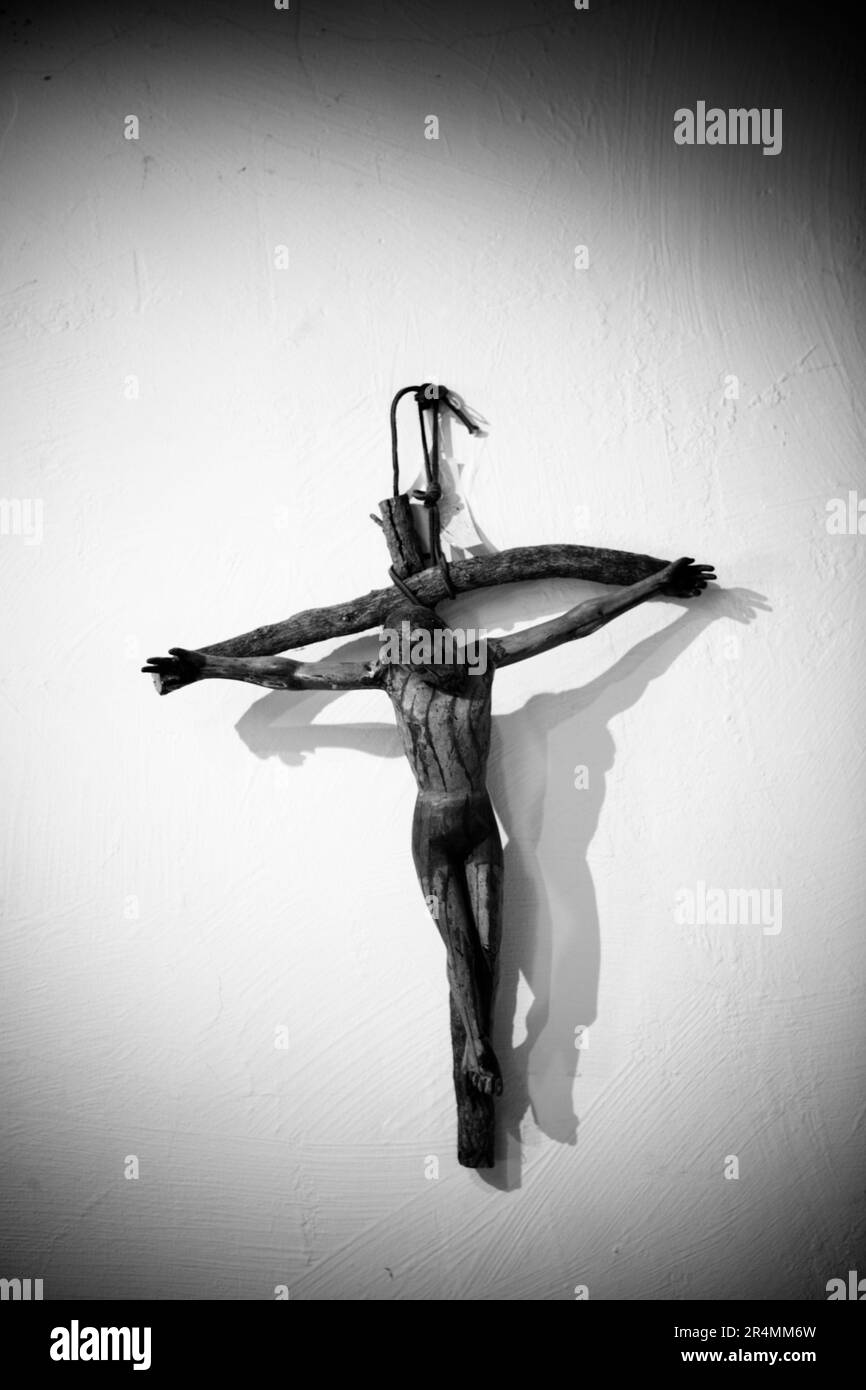 A cross hanging on the wall in the Santa Barbara Mission, Santa Barbara, California. Stock Photo