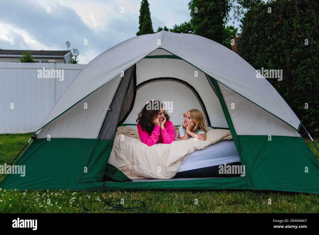 child and adult in tent in backyard Stock Photo Alamy