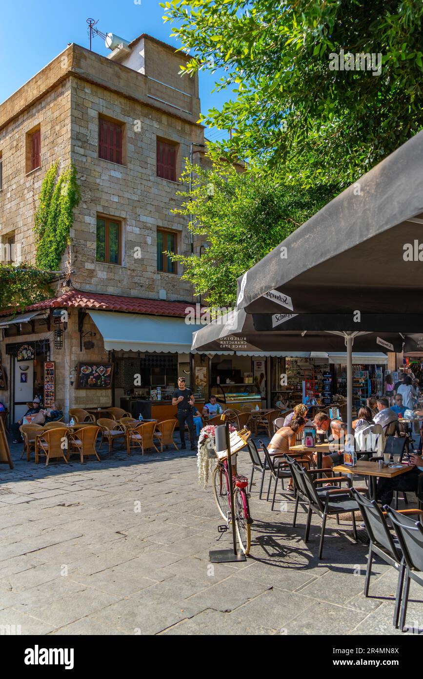 View of shops and cafes on Soktratous, Old Rhodes Town, UNESCO World Heritage Site, Rhodes, Dodecanese, Greek Islands, Greece, Europe Stock Photo