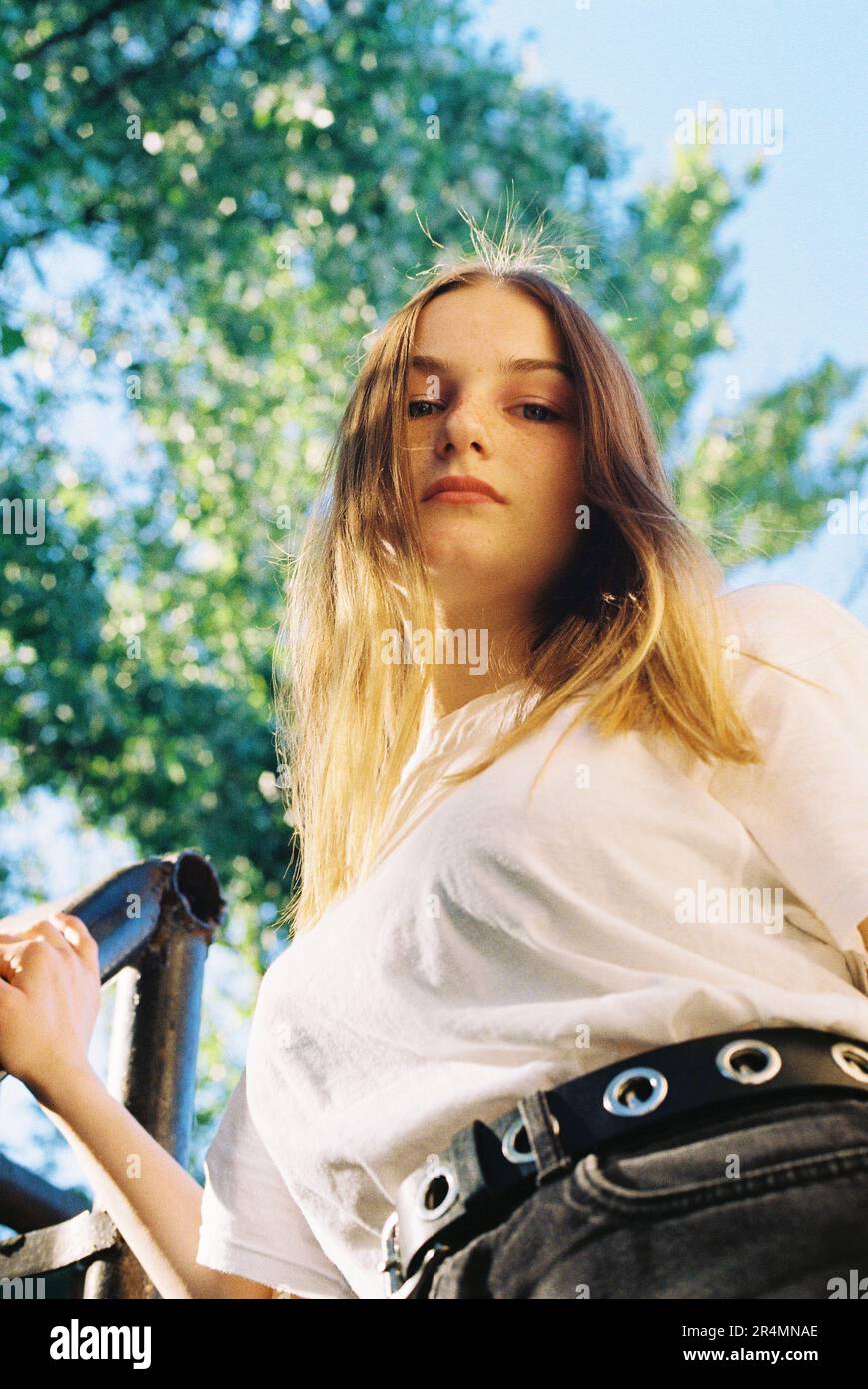 close-up portrait of a young woman near the tree Stock Photo