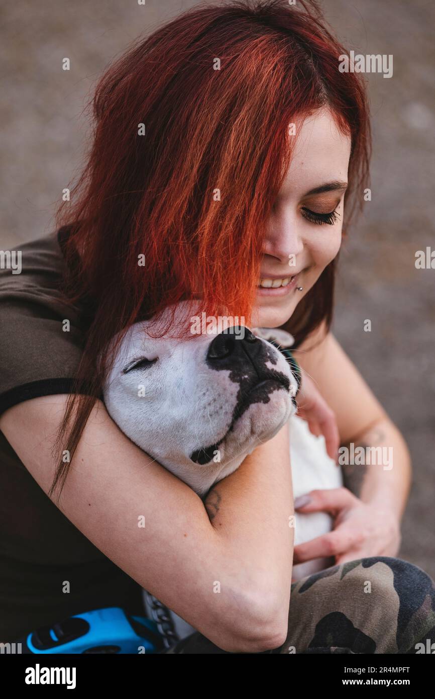 Woman and her pet - argentinian dog Stock Photo