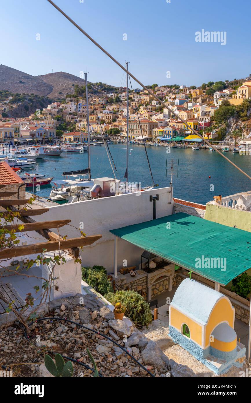 View of harbour from elevated position in Symi Town, Symi Island, Dodecanese, Greek Islands, Greece, Europe Stock Photo