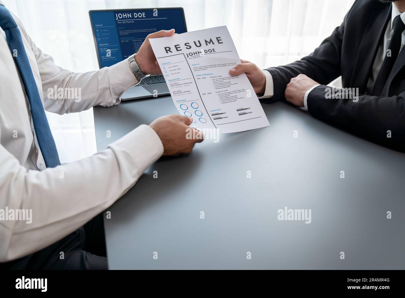 Interviewing job applicant in office with resume paper. Candidate wear ...