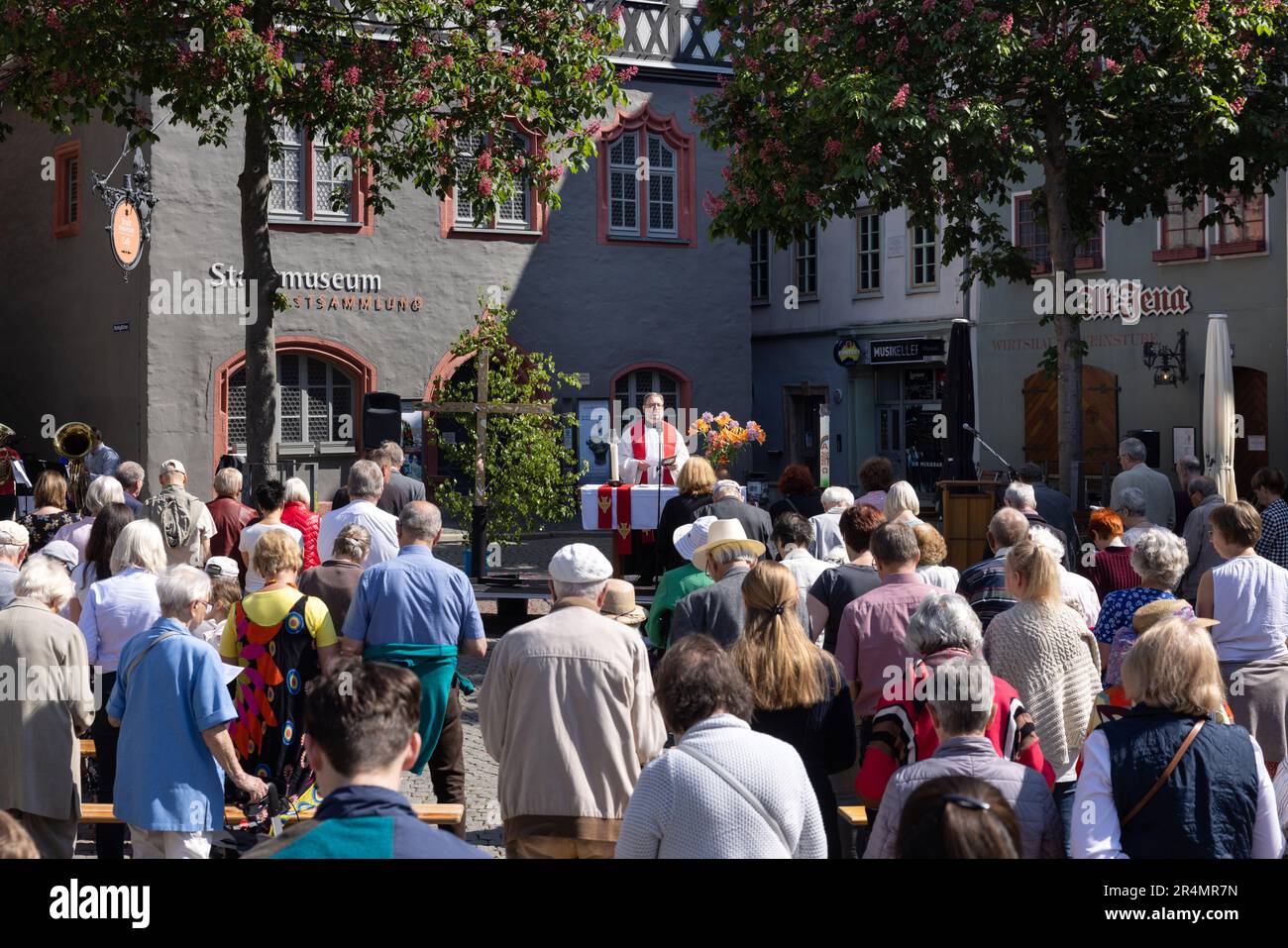 Jena, Germany. 29th May, 2023. Pastor Stephan Riechel speaks at an ecumenical open-air service in the market square on Whit Monday. Throughout Thuringia, numerous events will take place over Whitsun. Credit: Michael Reichel/dpa/Alamy Live News Stock Photo