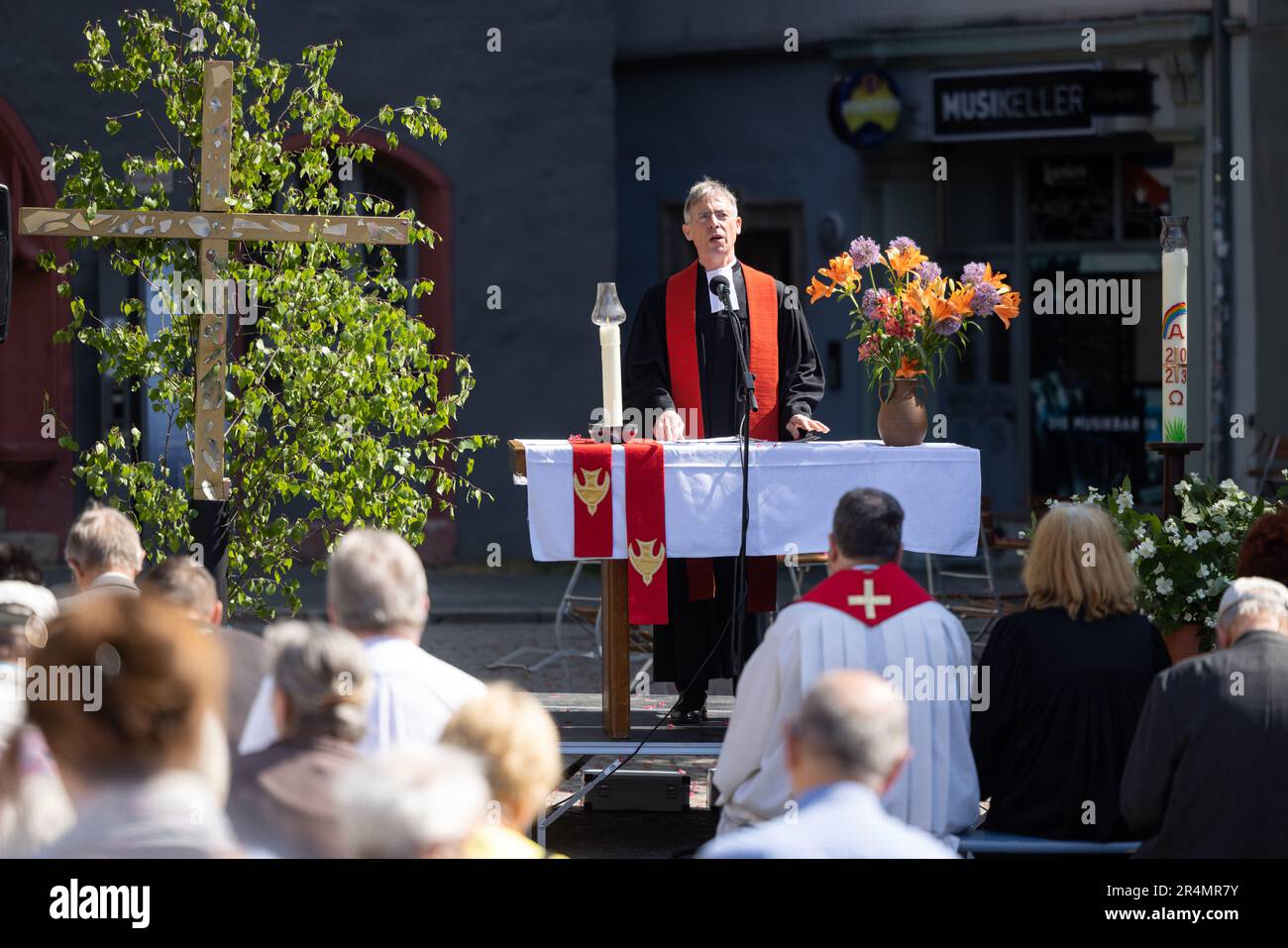 Jena, Germany. 29th May, 2023. Pastor Sebastian Neuß, Superintendent in the Jena church district, speaks at an ecumenical open-air service on Pentecost Monday on the market square. Numerous events are taking place across Thuringia over Whitsun. Credit: Michael Reichel/dpa/Alamy Live News Stock Photo