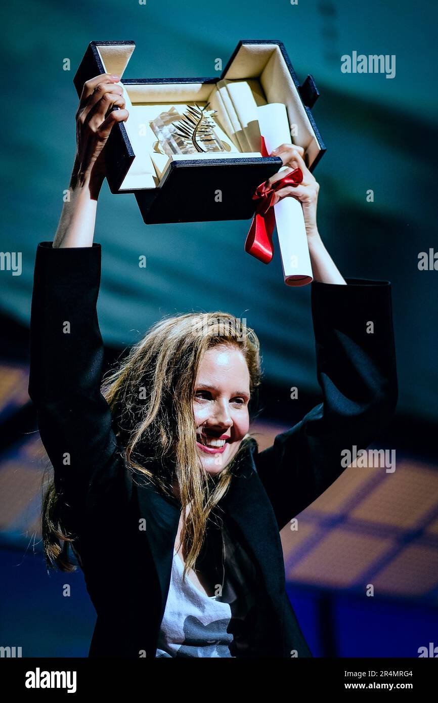 Justine Triet with her Palme D'Or Award for 'Anatomy of a Fall' photographed during the Closing Ceremony  for the 76th Cannes International Film Festival at Palais des Festivals in Cannes, France on 27 May 2023. Stock Photo